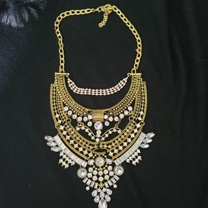 Gold with stunning stones intricate design heavy, chunky necklace